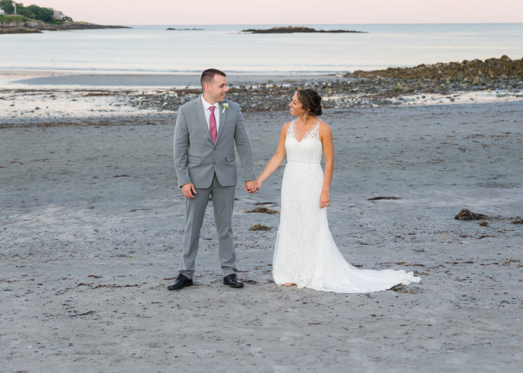 Bride and Groom standing near the ocean